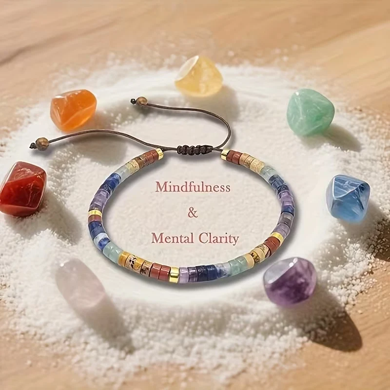 seven chakra gemstones arranged from root chakra to crown chakra